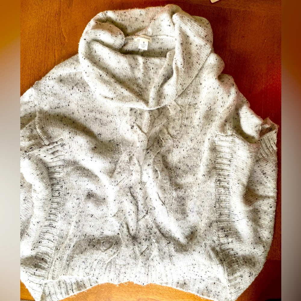 Short sleeved, turtle neck sweater.
